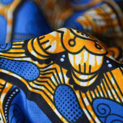 Tissu Wax Africain aux motifs traditionnels en bleu et jaune