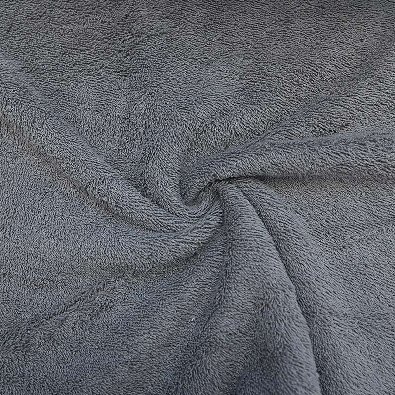 Tissu éponge uni gris anthracite, idéal pour des créations de bain élégantes.