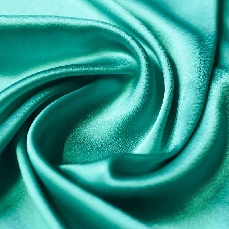 Tissu Satin de Luxe Turquoise – Un Textile Fluide et Lumineux